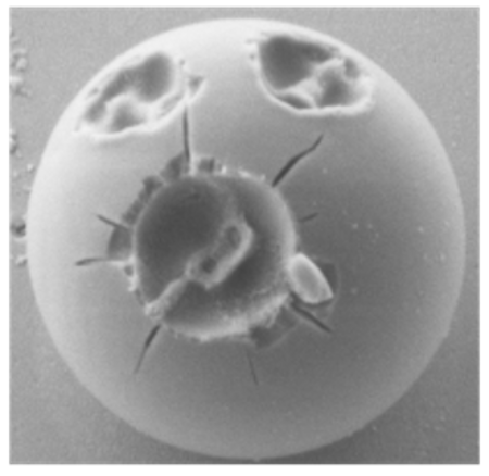 Scanning electron micrograph of a 2.95 µm silica particle. Each of the three craters was ablated by a single femtosecond pulse.  © Max Planck Institute for the Science of Light
